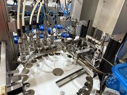 Wick und Schaefer GmbH Rotary Filler with Cap Sorter and Capper