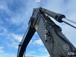 Volvo EC300EL crawler excavator w/ rototilt, cleaning an