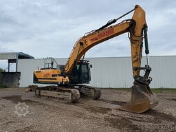 Hyundai HX300 NL with a bucket and ripper