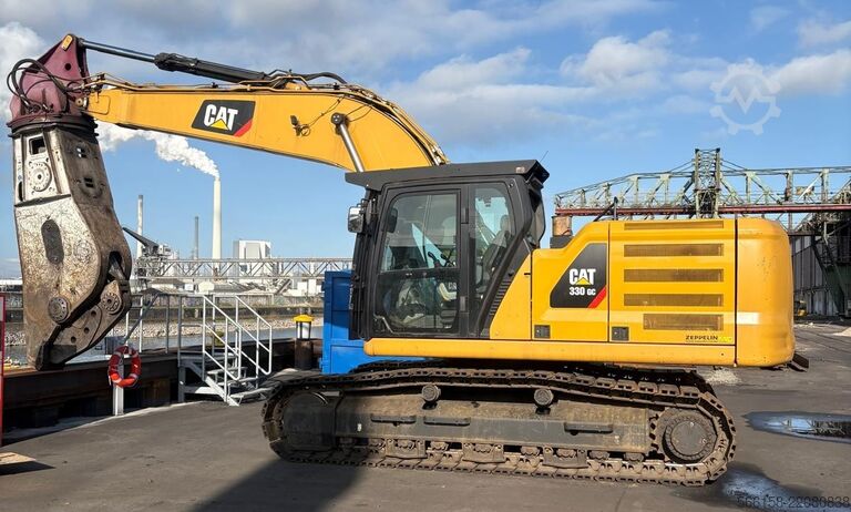 Penggali rantai dengan gunting besi buruk Caterpillar 330 GC