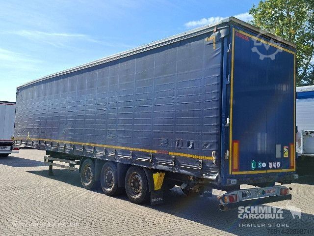 Avoin puoliperävaunu pressulla Kögel Curtainsider Mega