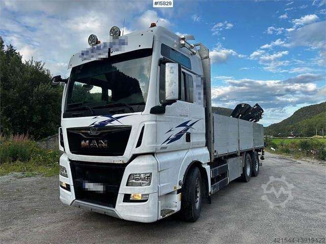 MAN TGX 26.560 Flatbed truck with Hiab 138 crane from