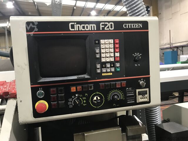 токарный станок с ЧПУ с подвижной головкой и подающим устройством для прутка Citizen Cincom F20