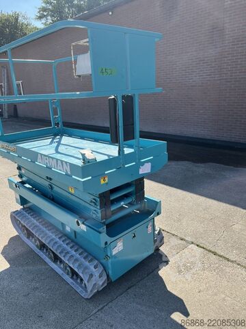 Plataforma elevadora de tijera sobre orugas usada Airman ENCL.061 AIRMAN ENCL.061