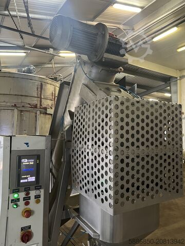 Weighing and packaging machine for frozen foods