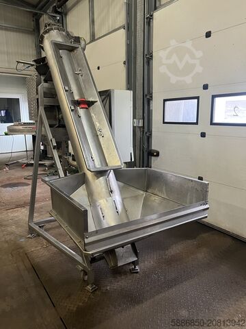 Weighing and packaging machine for frozen foods