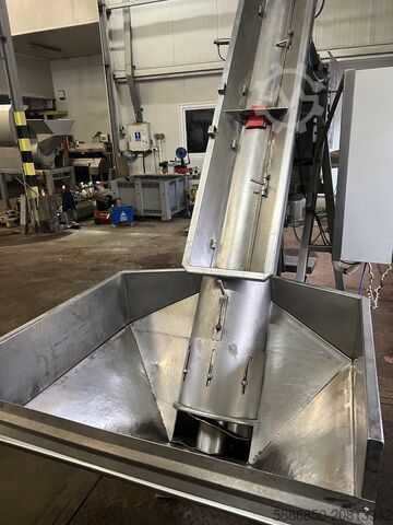 Weighing and packaging machine for frozen foods