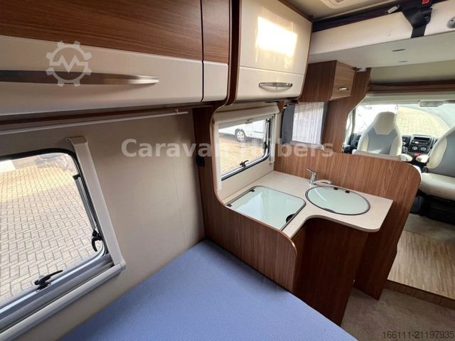 Semi-integrated camper CARADO T 348 - Hub/Festbett - Klima - Garage -