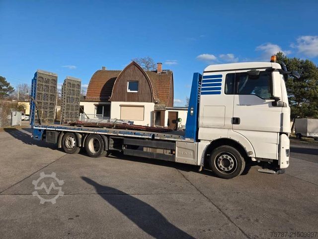 টাও ট্রাক MAN 26.400 TGX mit Baustoffplateau, geteilte Rampen