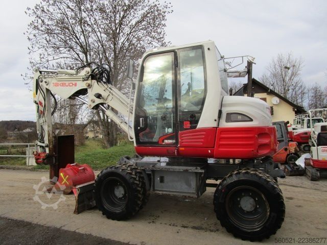Riteņu ekskavators Takeuchi TB 295W - POWERTILT + Schnellw + 3 Löffel