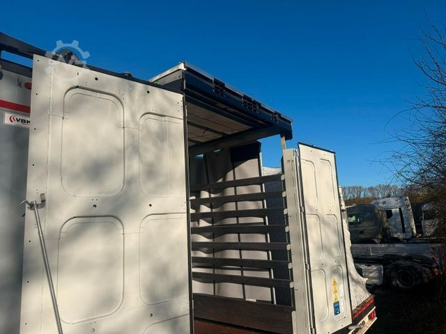 Відкритий напівпричіп з тентом KRONE SDP 27 Stufensattel Auflieger mit Spreizheck