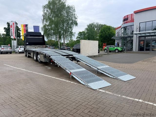 Camión de plataforma MAN Baumaschinen Maschinentransporter mit Rampen