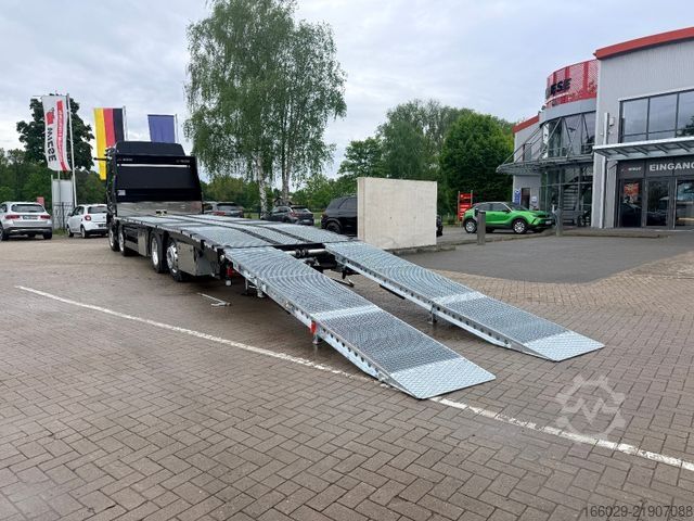Grúa de remolque MAN Baumaschinen Maschinentransporter mit Rampen