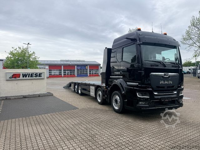 Grúa de remolque MAN Baumaschinen Maschinentransporter mit Rampen