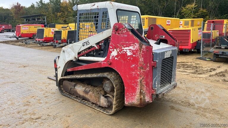 Kompaktlader auf Kette Takeuchi TL130 with forks and loader bucket