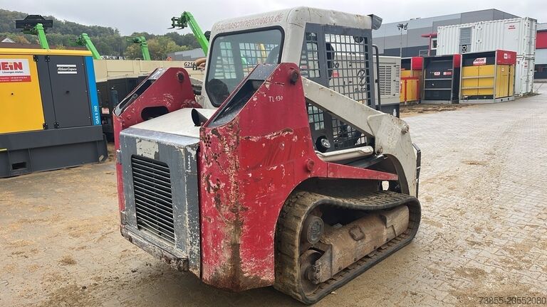 Kompaktlader auf Kette Takeuchi TL130 with forks and loader bucket