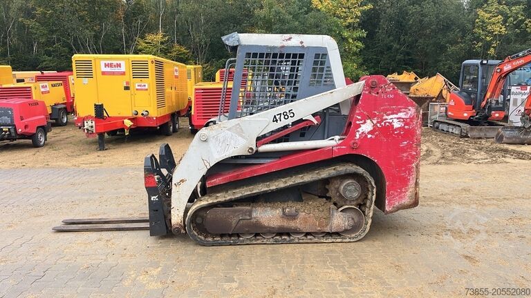 Kompaktlader auf Kette Takeuchi TL130 with forks and loader bucket