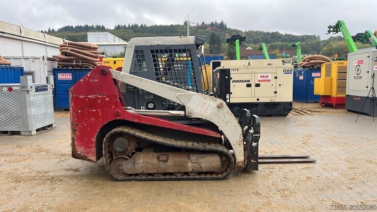 Kompaktlader auf Kette Takeuchi TL130 with forks and loader bucket