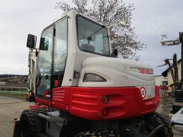 รถขุดล้อยาง Takeuchi TB 295W - POWERTILT + Schnellw + 3 Löffel