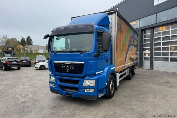 Flatbed truck with tarp MAN TGS 26.440 6x2