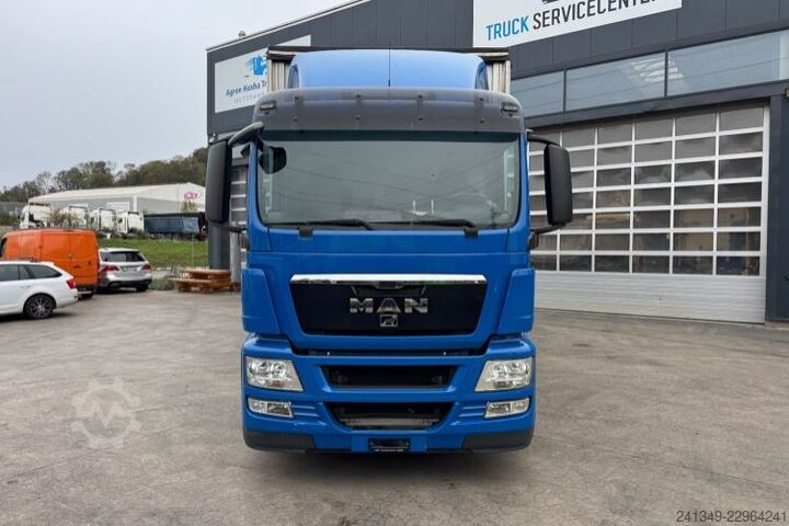Flatbed truck with tarp MAN TGS 26.440 6x2
