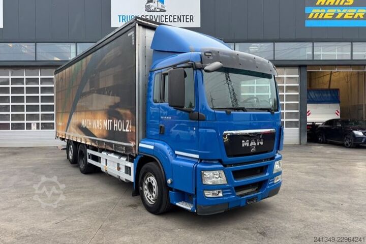 Flatbed truck with tarp MAN TGS 26.440 6x2