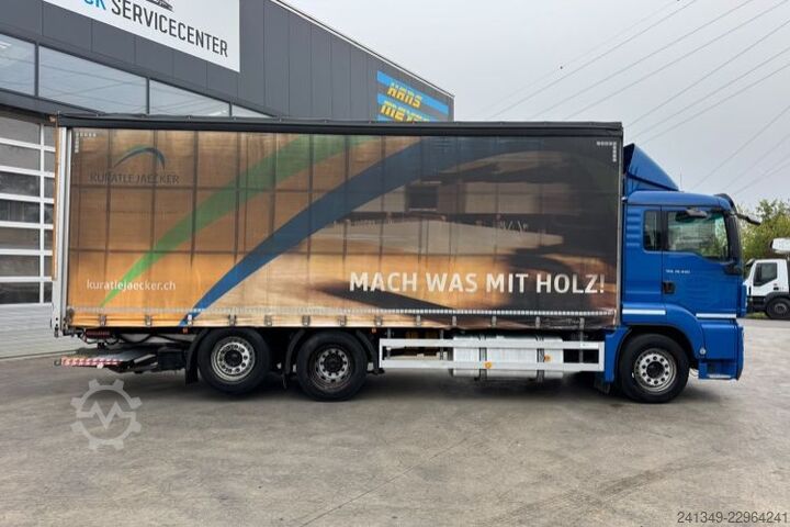 Flatbed truck with tarp MAN TGS 26.440 6x2