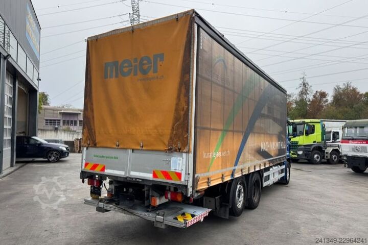Flatbed truck with tarp MAN TGS 26.440 6x2