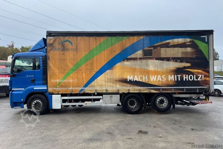 Flatbed truck with tarp MAN TGS 26.440 6x2