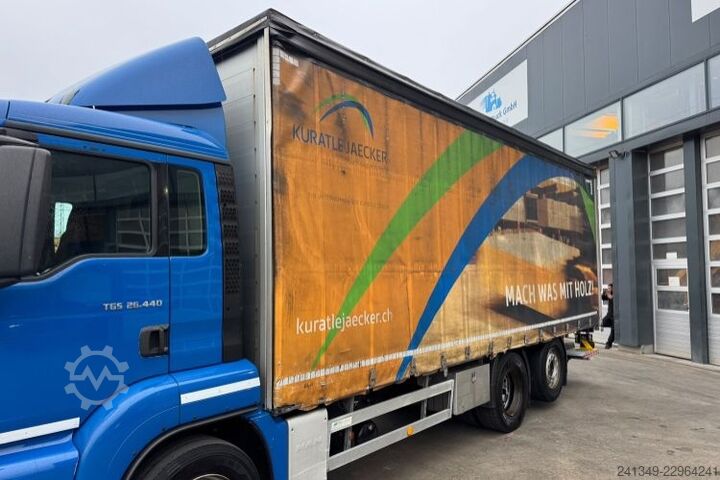 Flatbed truck with tarp MAN TGS 26.440 6x2