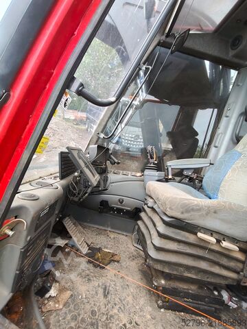 Penuai dengan Kepala Penuai Komatsu 941.1