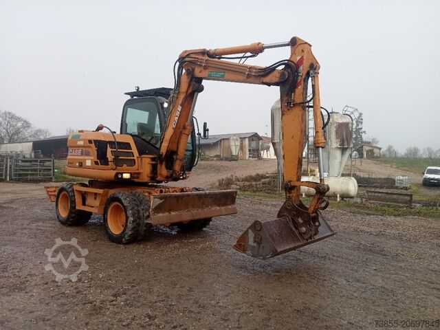 Kolové rypadlo Case WX95 with 4 excavator buckets and forks