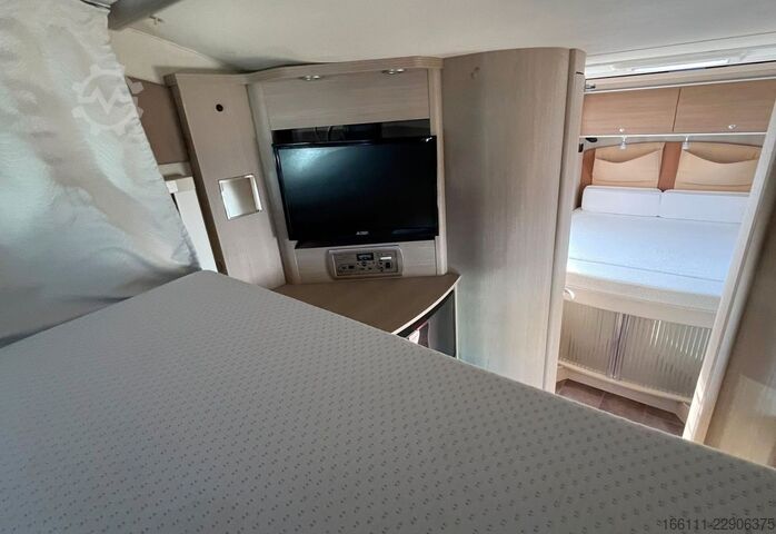 Autorulotă semi-integrată BÜRSTNER Ixeo T 734 - Hub/Queensbett - Klima -