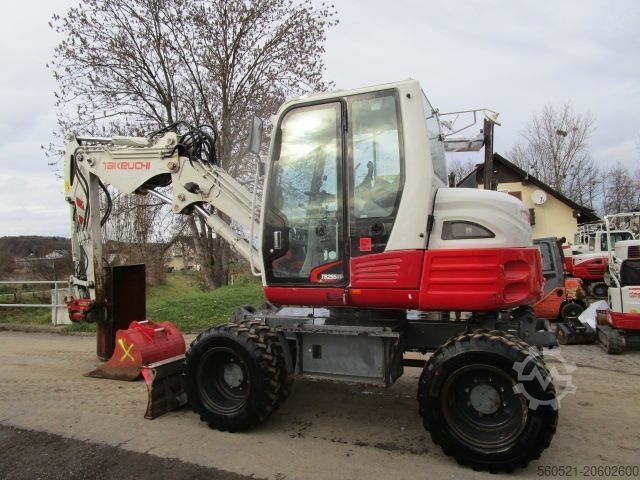 Kolesové rýpadlo Takeuchi TB 295W - POWERTILT + Schnellw + 3 Löffel