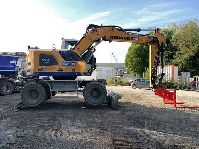 Escavadora sobre rodas Liebherr A913 Compact Litronic with 3 excavator buckets